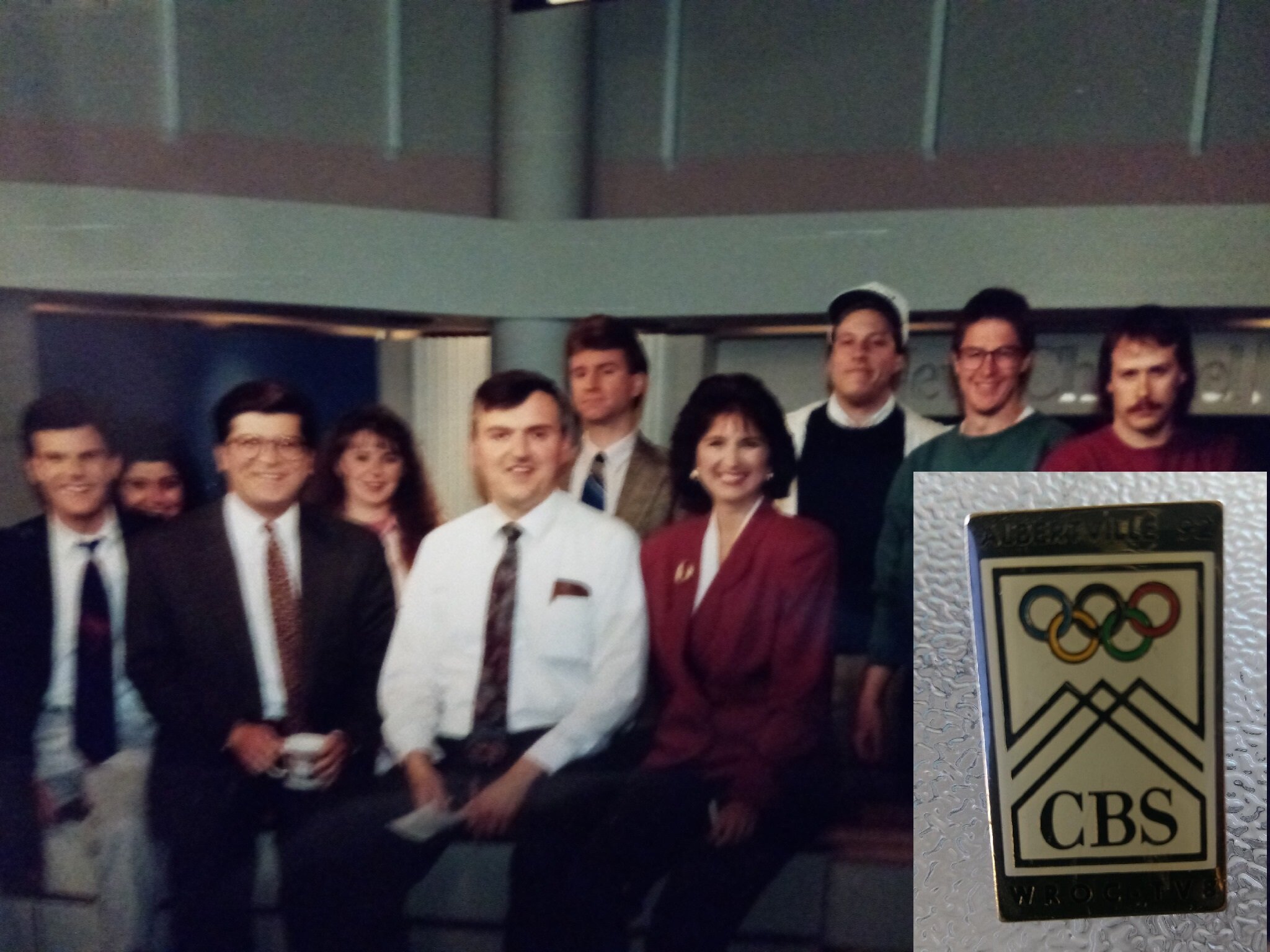 Part of the news team I worked with thirty years ago. I’m the guy in the white shirt, tie, and dark hair. Inset: a special pin made in anticipation of the 1992 Winter Olympics in Albertville, France. Photo: Newvine Personal Collection