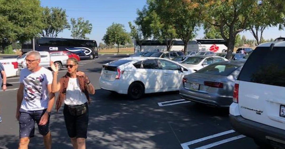 Visitors depart their motor coach for a rest stop at a local supermarket. Photo: Steve Newvine