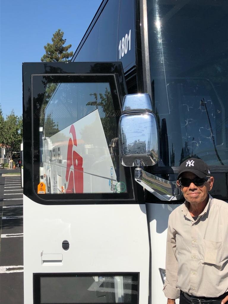 Driver Juan stands in front of his bus. Juan drives for a company based in Los Angeles and he’s been to Yosemite dozens of times. Photo- Steve Newvine