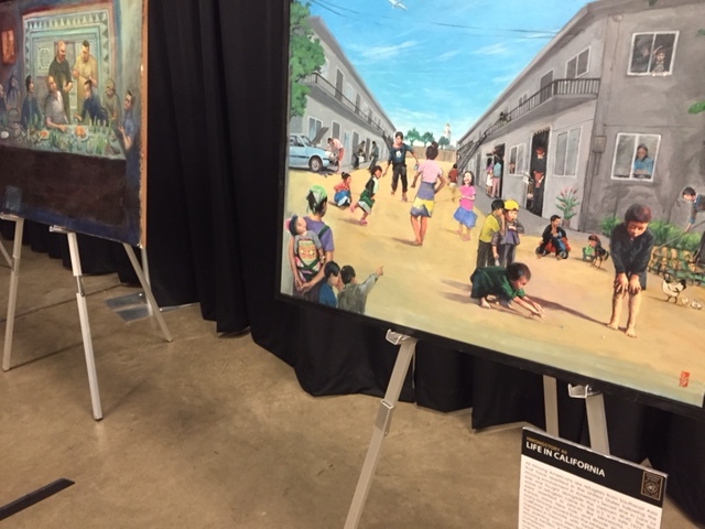 Paintings by Hmong artists depicting life in California. Photo by Steve Newvine