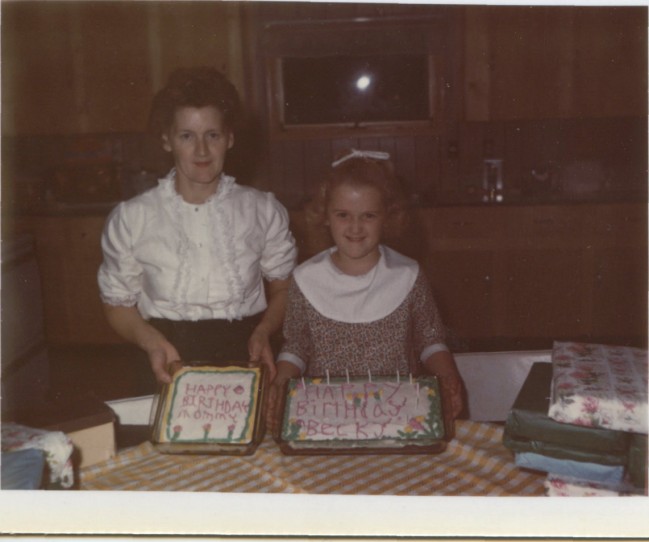 Circa 1970, My Mom and sister Becky celebrate their birthdays together with two cakes. Photo from the Newvine Personal Collection