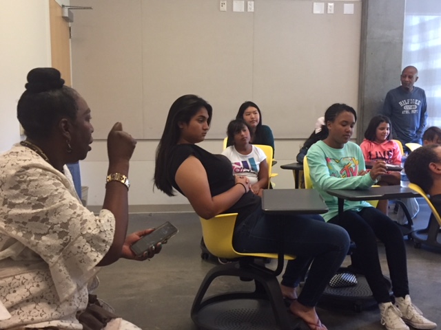 Harvest Park Education Center Managing Director Gloria Morris emphasizes a point to students and internees in the Summer Enrichment Program. Photo by Steve Newvine