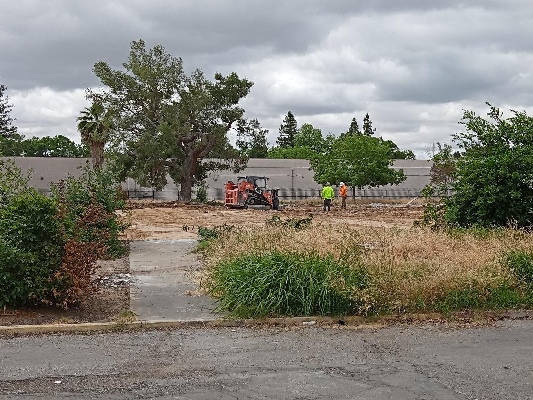 A handful of workers remained on site as what was left from the former Sun Star building was trucked away. Photo: Steve Newvine