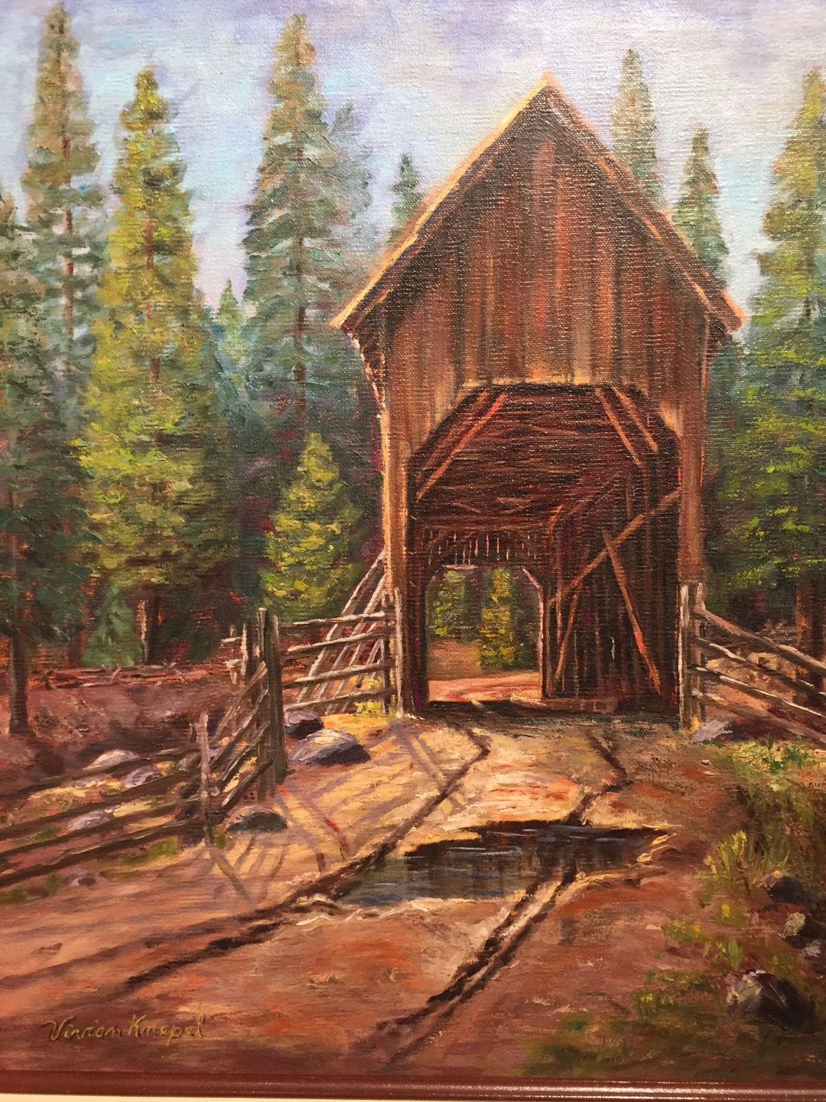 This covered bridge painting that is part of the Originals of Yosemite exhibition is from Vivian Knepel. She was well-known for paintings of a variety of scenes from Yosemite.