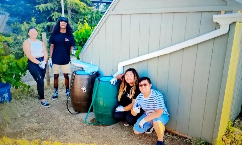 The UC Merced student team with their test-of-concept solution site on the campus. L-R: Rosa Ruiz, Kainoa Ferguson, Robylene Seapno, & Steven Nguyen. Photo: Rainwater Irrigation Planning team, UC Merced