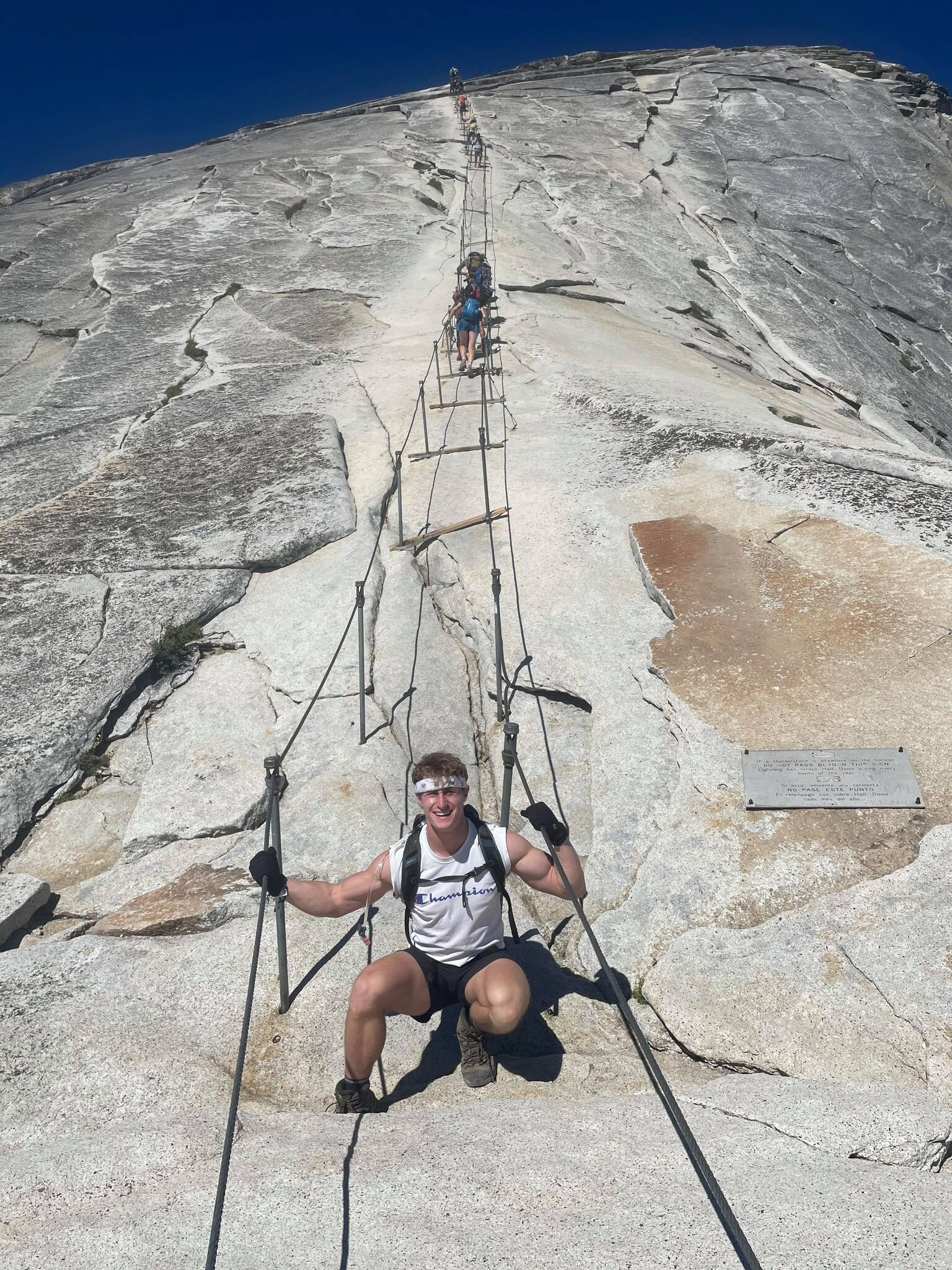 Brennen Thompson at the bottom looking up Half Dome at Yosemite National Park. Photo: ValleyTough.com