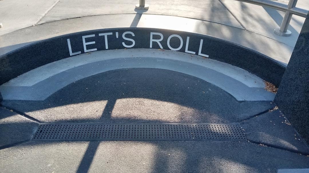 Engraving on the step of the Flight 93 section of the California 9-11 Memorial. These were the words of one of the passengers in the flight that stopped the hijackers from attackers from a planned assault in Washington. Photo: Steve Newvine
