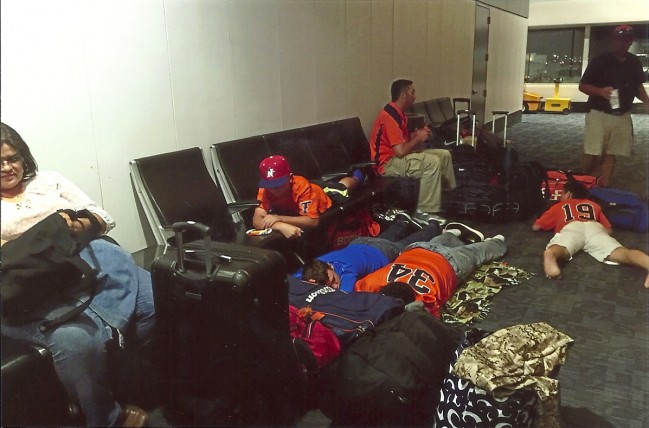 Jet Lagged and Road Weary, the Titans wait in an airport for the next leg of their journey. Photo by Titans Elite