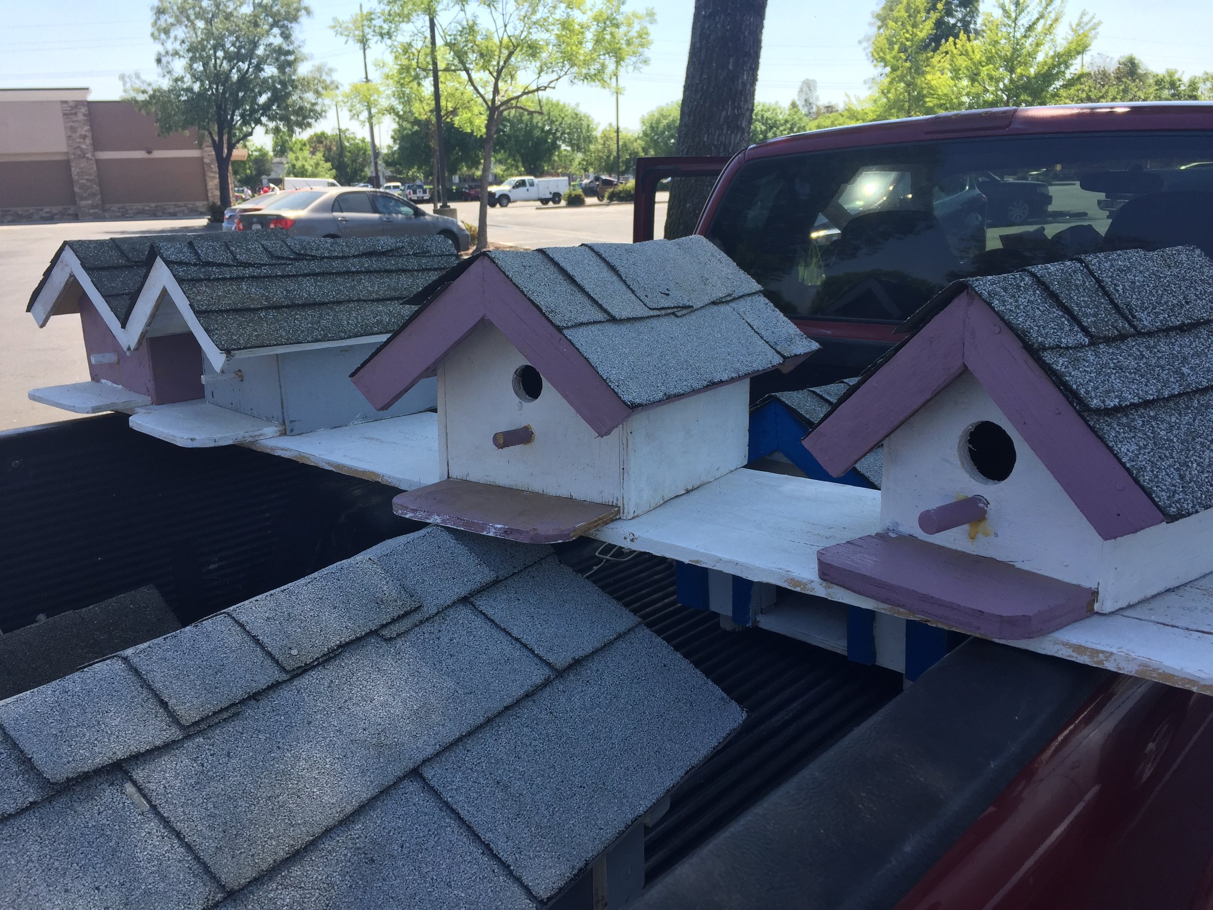 Ben’s selection of dog houses and birdhouses change as some are purchased and new ones are finished. Photo- Steve Newvine