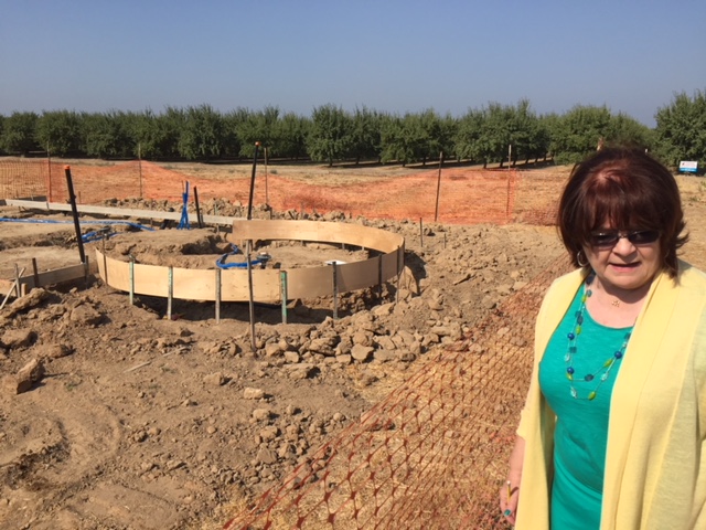 Center director Michele Pecina shows the round work that has already started for the Mammoth Orange Stand at the Fossil Discovery Center of Madera County. Photo by Steve Newvine