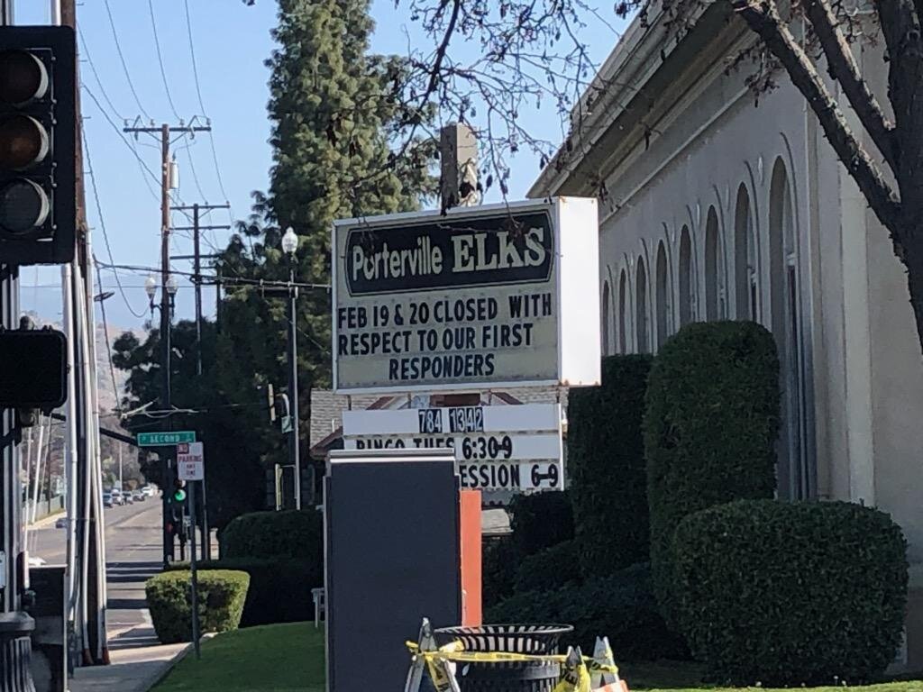 This sign in front of the Porterville Elks Club announces the postponement of activities out of respect for the first responders. Photo by Steve Newvine
