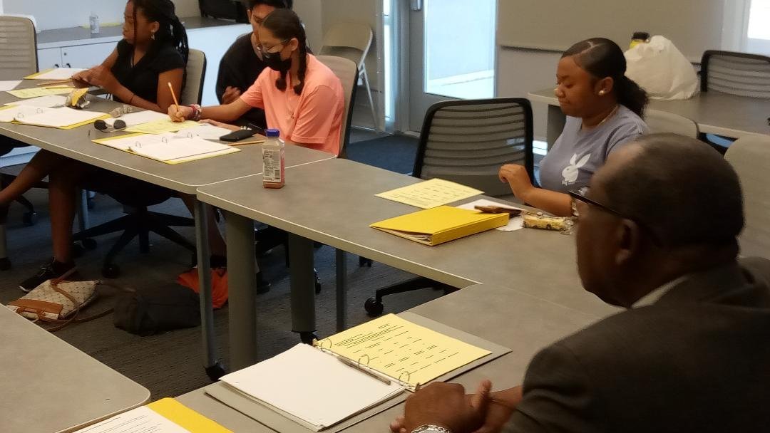 Retired Merced County Director of Workforce Development Robert Morris helps students in the Summer Prep Academy research what they need to do in order to pursue their preferred career paths. Photo: Steve Newvine