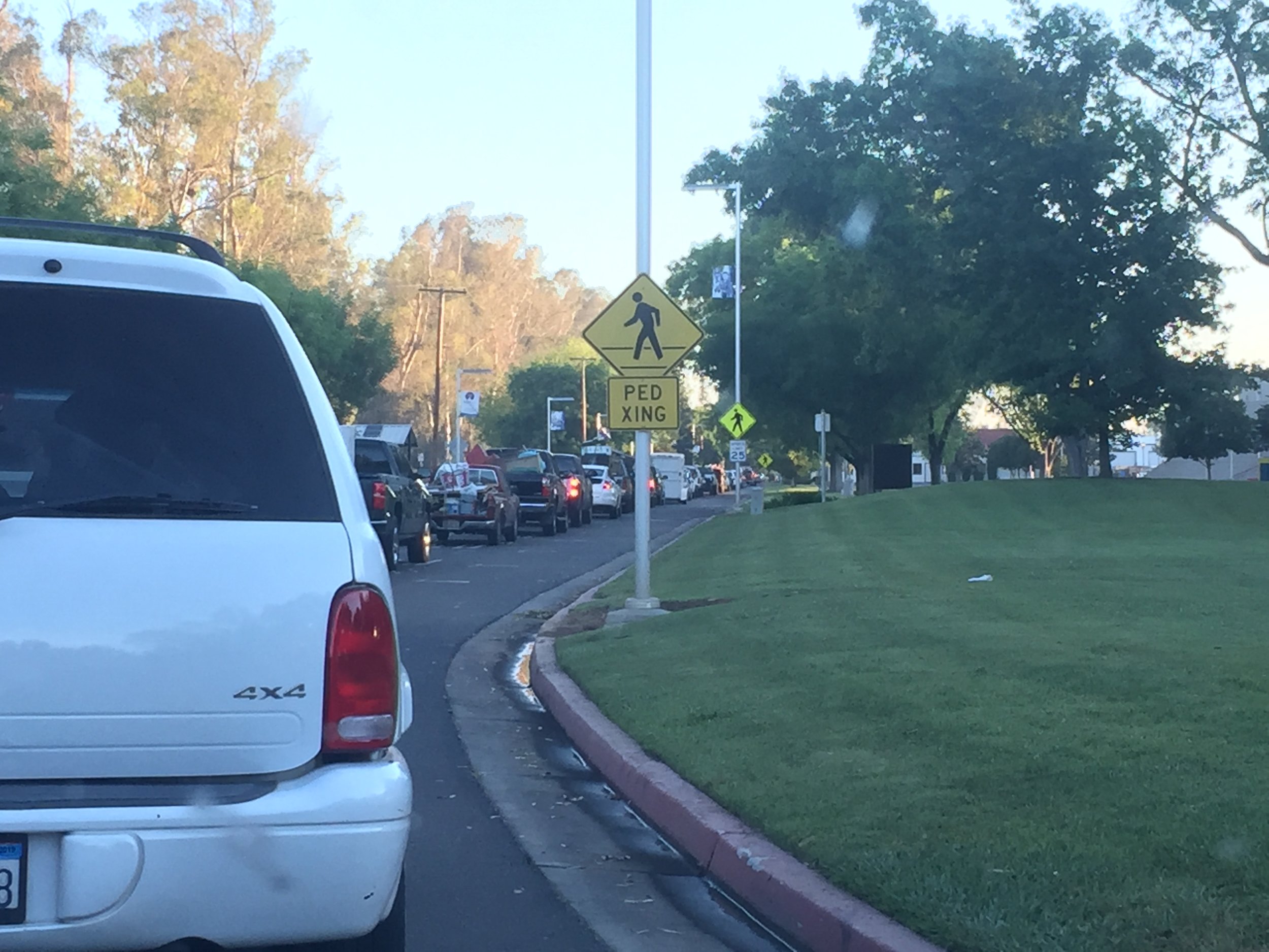 Mini-vans, pick-up trucks, SUVs, and cars line up to drop off their owners’ stuff at Spring Clean-Up Days in Merced. Photo- Steve Newvine