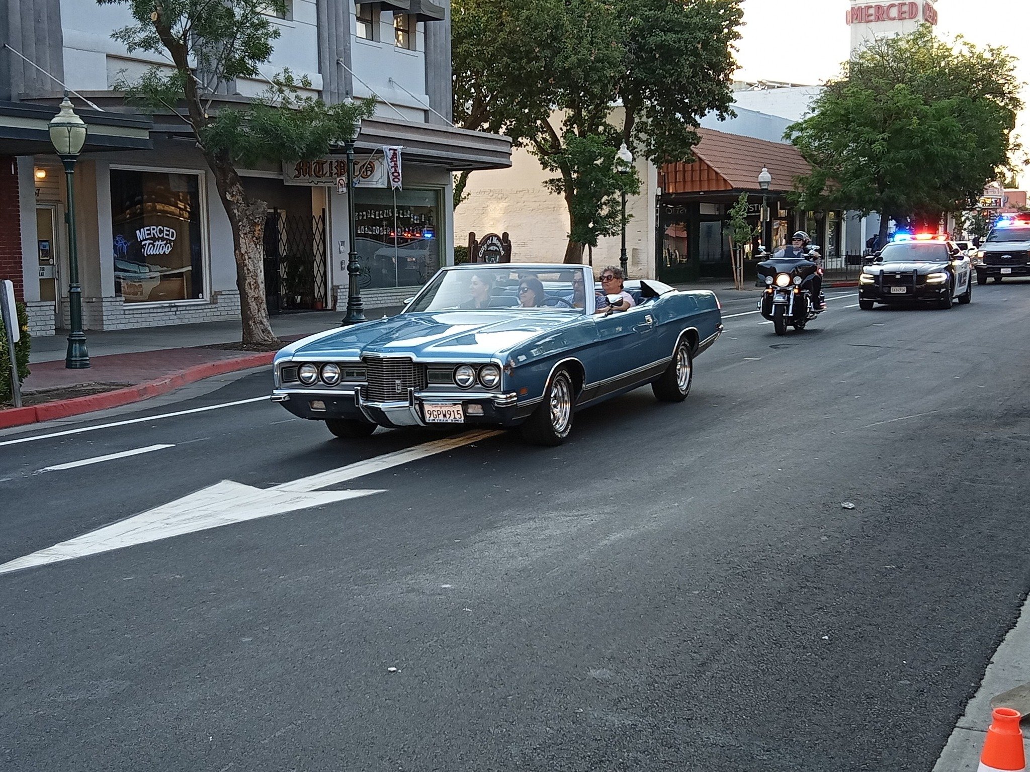 This classic convertible leads a city Police Department array of vehicles that were part of the cruise down Main Street. Photo: Steve Newvine
